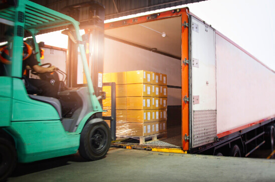 Dolly loading cargo into a truck