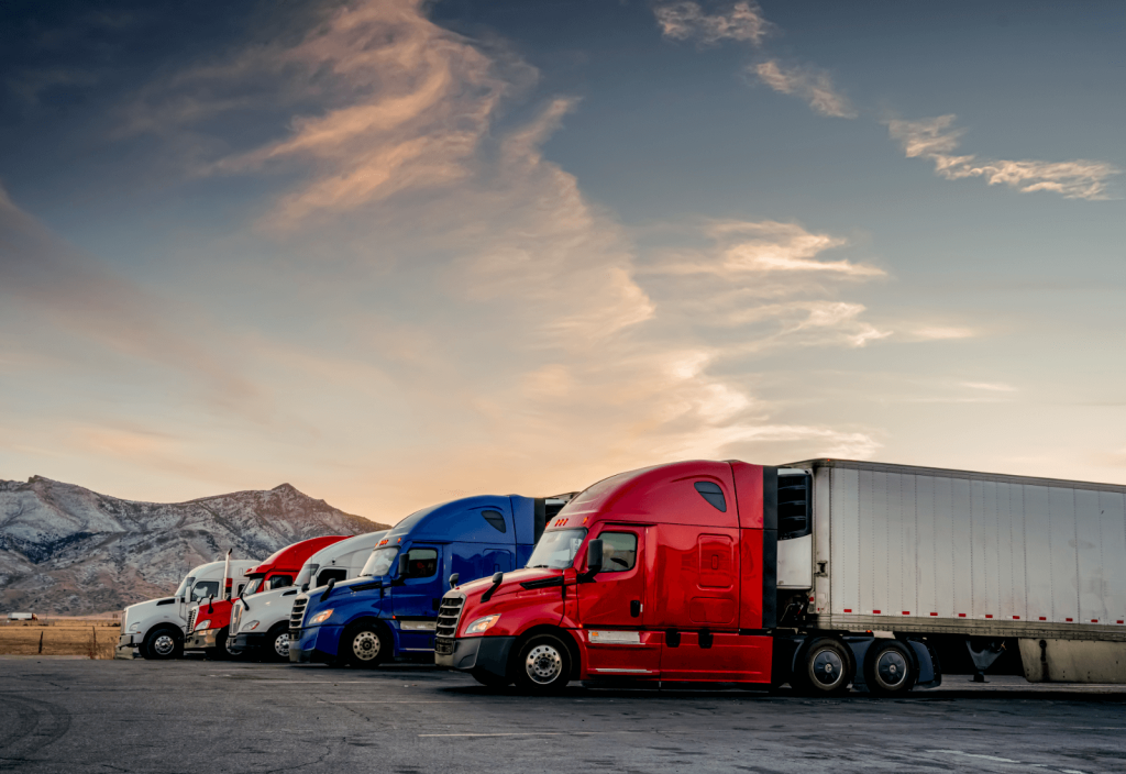 Red White and Blue Parked Trucks Lined up at a Truck Stop in the wintertime in Utah